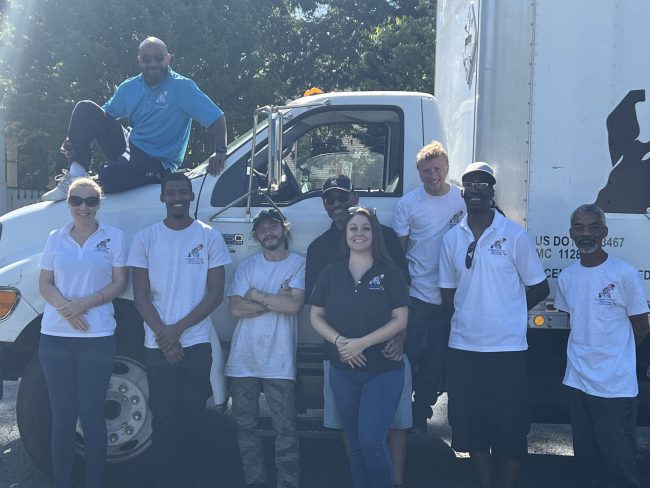 Professional movers wrapping furniture during Loganville Georgia move Professional movers wrapping furniture during Loganville Georgia move