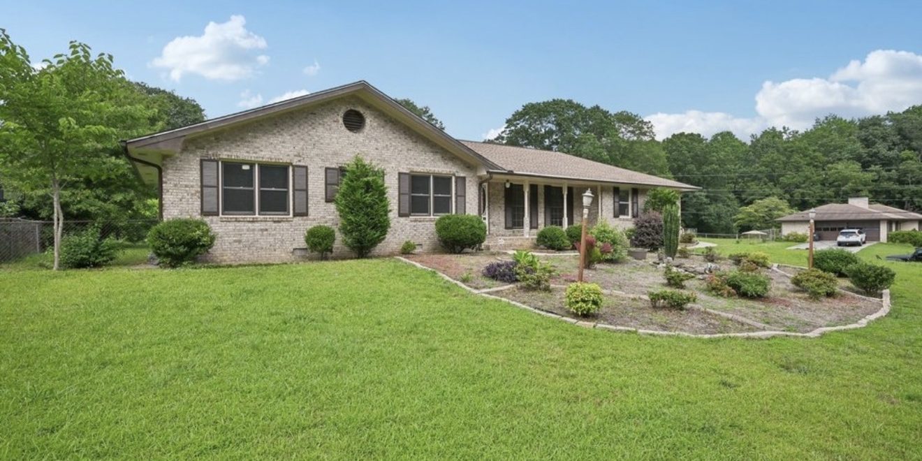 Professional movers wrapping furniture