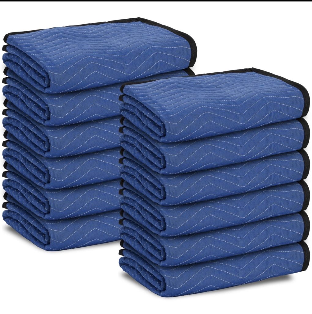 Professional movers wrapping furniture during Snellville Georgia move | Lawrenceville Moving Company | LIBERTY PRO MOVING Professional movers wrapping furniture during Snellville Georgia move