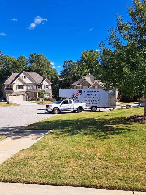 Professional movers wrapping furniture during Norcross GA relocation