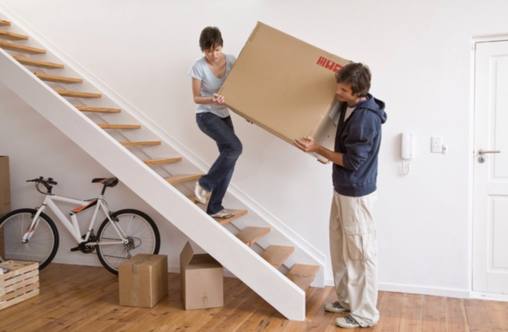 Liberty Pro Moving team performing stair carry during Loganville move | Lawrenceville Moving Company | LIBERTY PRO MOVING Liberty Pro Moving team performing stair carry during Loganville move