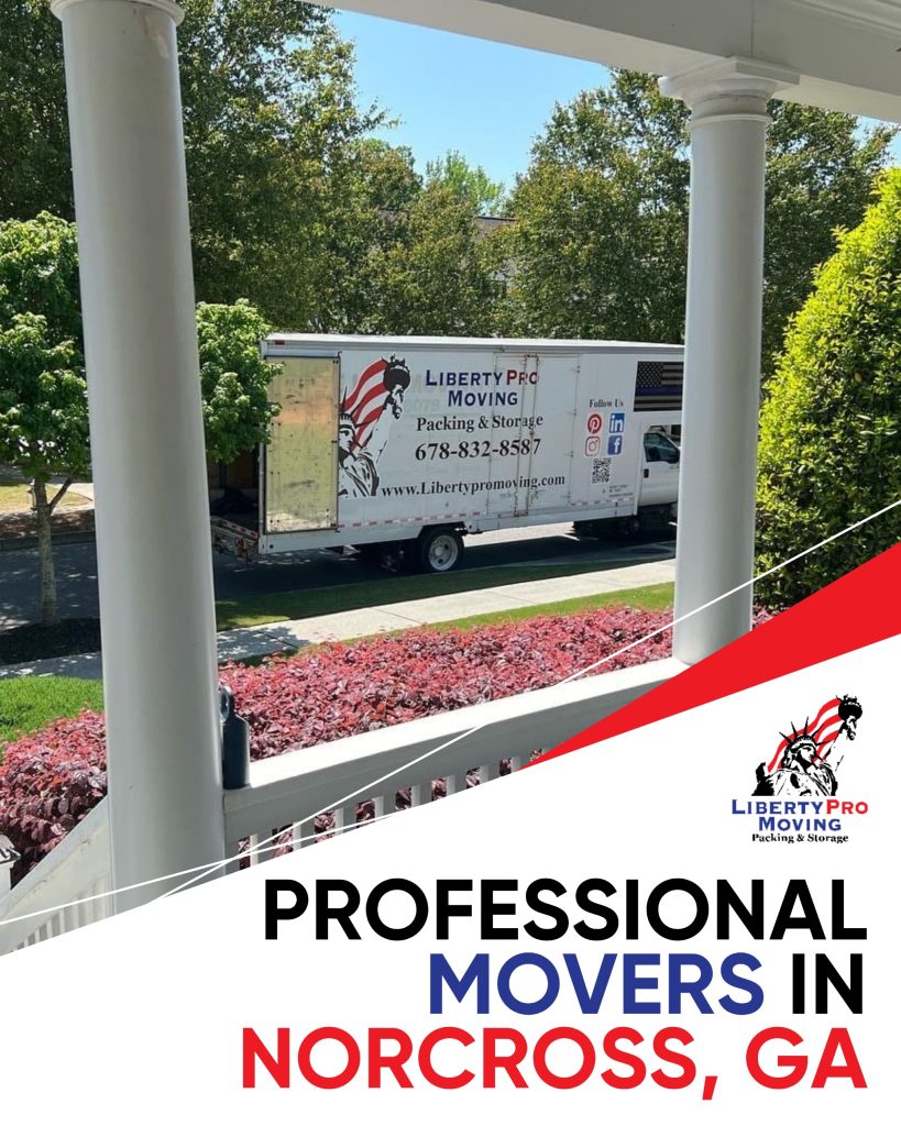Professional movers carrying couch into truck for move in Georgia | Lawrenceville Moving Company | LIBERTY PRO MOVING Professional movers carrying couch into truck for move in Georgia
