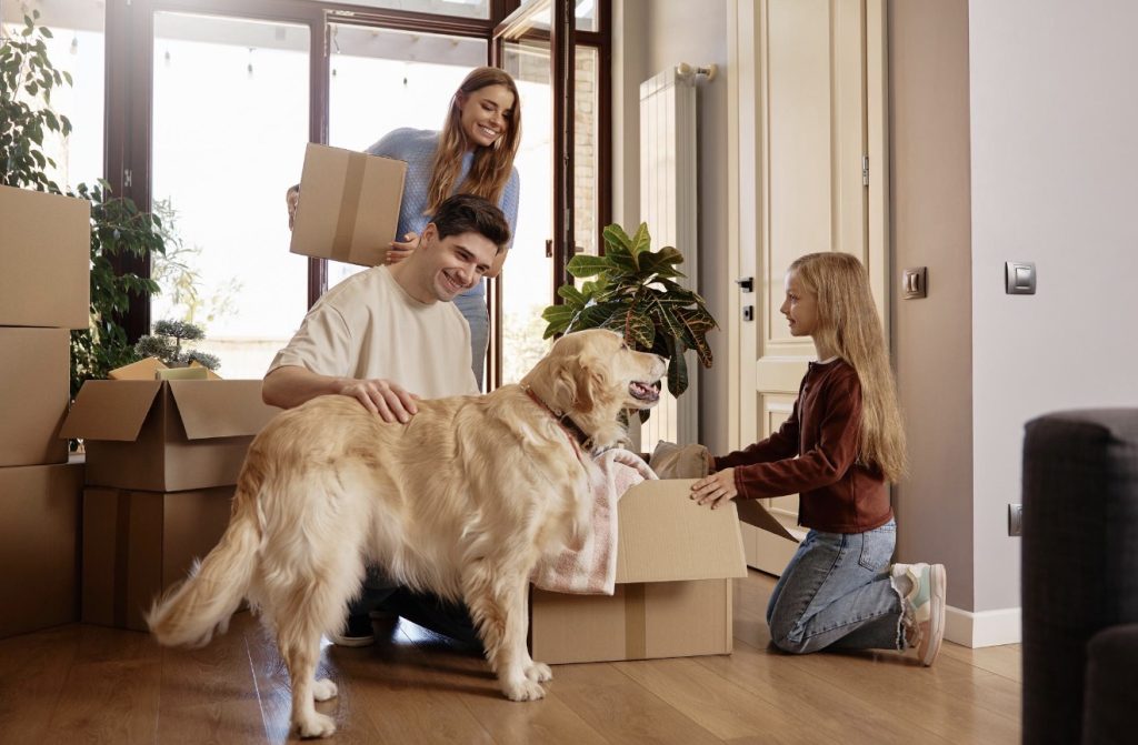 Family unpacking moving boxes in their new home | Lawrenceville Moving Company | LIBERTY PRO MOVING Family unpacking moving boxes in their new home