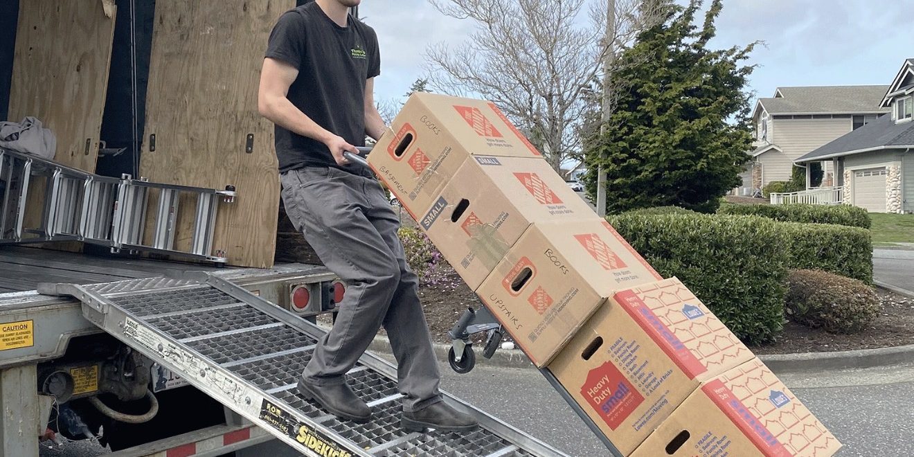 moving truck being packed by professional movers