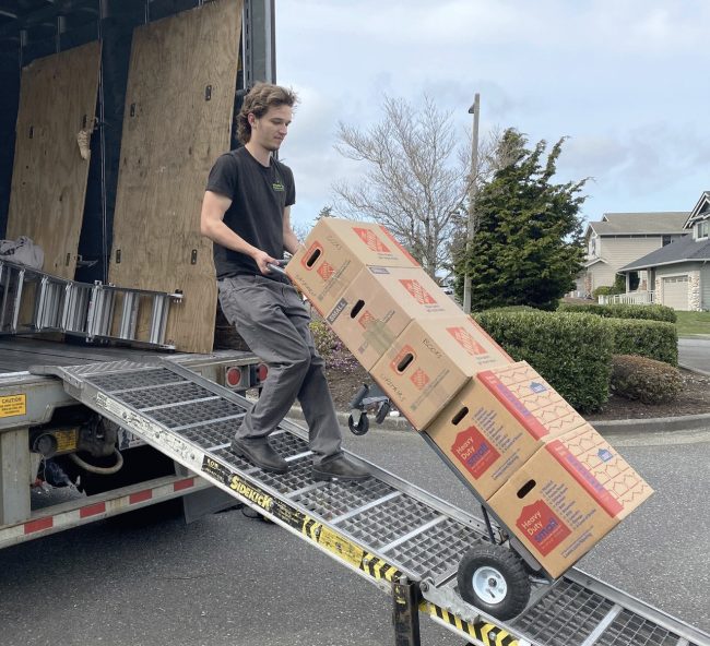 moving truck being packed by professional movers