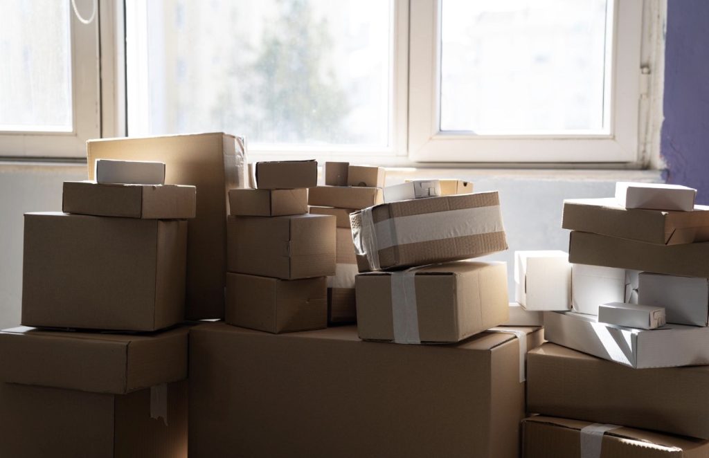 Cardboard moving boxes stacked and labeled for organized moving | Lawrenceville Moving Company | LIBERTY PRO MOVING Cardboard moving boxes stacked and labeled for organized moving