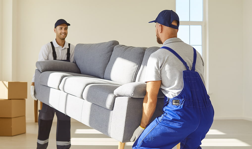 Movers carrying couch upstairs safely | Lawrenceville Moving Company | LIBERTY PRO MOVING Movers carrying couch upstairs safely