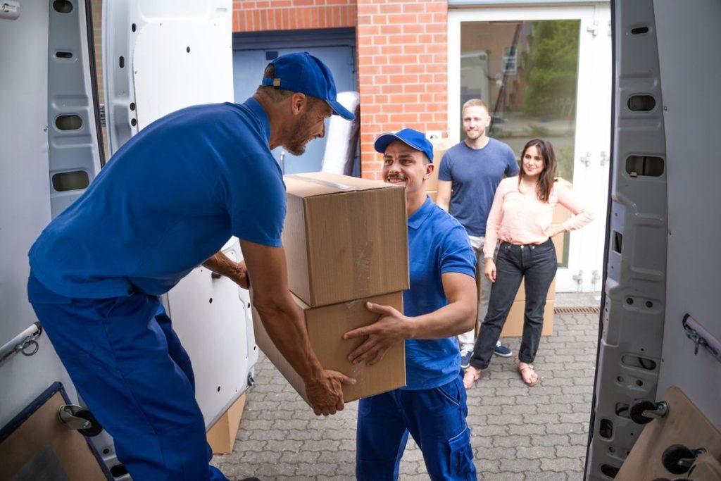 Movers carrying couch upstairs safely | Lawrenceville Moving Company | LIBERTY PRO MOVING Movers carrying couch upstairs safely